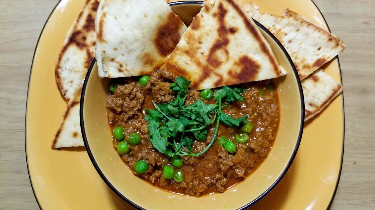 Indian Beef Curry With Peas And Buttery Naan