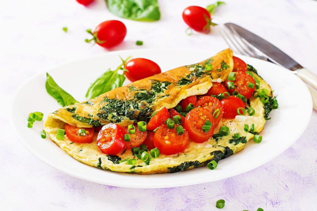 omelette-with-tomatoes-spinach-and-green-onion-on-ZLQ9AGP