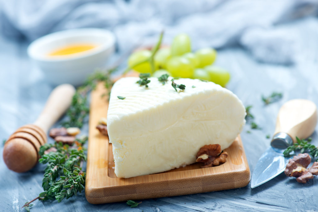 camembert with honey on board, stock photo