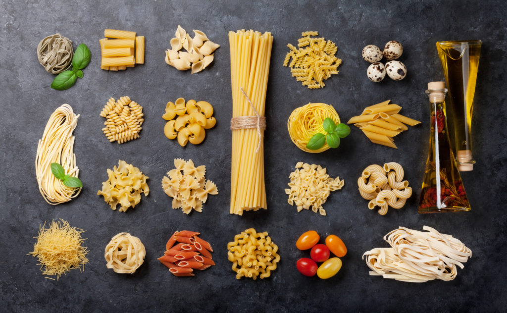 Various pasta and condiments. Cooking concept. Top view